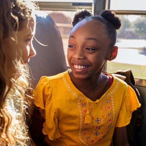 Girls talking on a bus